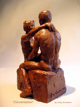 Load image into Gallery viewer, This view of the couple in terracotta shows the man&#39;s back, as well as the artist&#39;s signature Borsheim at the base.  Conversation, ceramic garden sculpture
