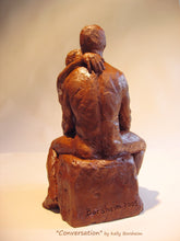 Load image into Gallery viewer, view of the husband&#39;s back with the wife&#39;s hand draped over his left shoulder.  Artist Borsheim signed the terra-cotta sculpture at the base or bottom.  Conversation, romantic gift art idea.
