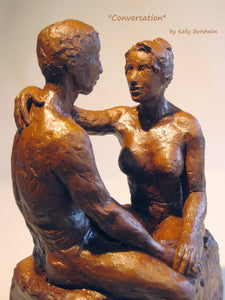 closeup view of a man and woman couple having a heart-to-heart paying attention conversation