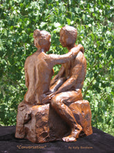 Load image into Gallery viewer, better view of man&#39;s left side and he speaks with his partner, ceramic sculpture set against the trees.
