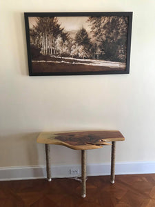 Monochromatic landscape oil painting looks great in this mostly warm neutral room decor. Shown with wood table made by another artist.