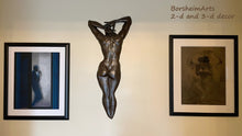 Load image into Gallery viewer, Bronze wall art is hung here with two framed pastel drawings shown with the classic white mat and elegant black frame. Figure art all by artist Kelly Borsheim
