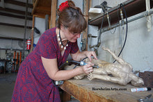 Charger l&#39;image dans la galerie, Artist Sculptor Kelly Borsheim chases / cleans the just-cast bronze figure of Against the Dying of the Light - Rage Rage bronze sculpture

