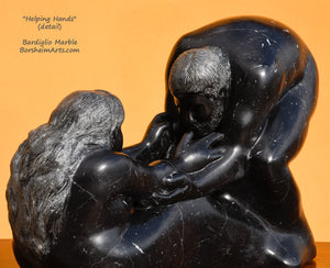 Here you may see the man's face and beard and he looks across to the woman's face as his large hands reach to grab her arms to help her stand. Helping Hands black marble figure sculpture