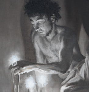 a man meditates while reaching for the candle fire.  his shadow rises dramatically behind him.  his hair is in dreadlocks and he has a trimmed beard. Nude from waist up, bare feet black man