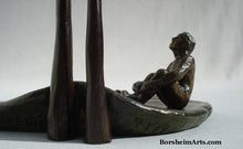 Load image into Gallery viewer, limited edition bronze sculpture detail of seated man.  signature on left, edition number to the right of the cattail stems.  bronze sculpture by Kelly Borsheim The Unwritten Future
